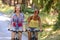 Two teenage girls riding their bikes