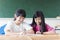 Two teenage girls student study in classroom