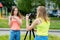 Two teenage girls. In the summer in the city. Writes the video to the camera. Concepts of young bloggers and bloggers
