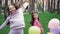 two teenage school girls having fun outdoors. in colourful clothes near hot air balloons. friendship, sisterhood