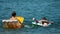 Two teenagers in buoy in the water on back view