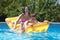 Two teenagers swimming in the pool