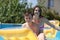 Two teenagers swimming in the pool