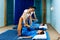 Two thai masseuses synchronously doing thai massage.