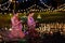 Two thai woman holding a krathong sitting on a raft by the river, Asian women in traditional Thai costumes bring krathongs to