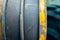 Two thick belts on the engine close-up. Drive belt old worn out on a yellow pulley, blurred background. Industrial items in