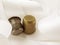 Two thimble bronze and silver on the background of white light satin ribbon