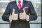 Two thumbs up business man close up at hand. male in suit show good best successful gesture