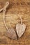 Two tied wooden hearts on old wood