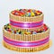 Two tier chocolate decorated with finetti sticks and colorful candy