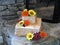 Two tier natural rustic cake with fondant sunflowers, chrysanthemums and daisies