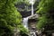 Two-Tier Waterfall Surrounded by Green Trees