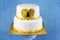 two tier white cake with gold lace and key hole. for 21st birthday theme