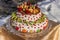 Two-tiered cake with fruits and chocolate