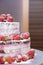 Two-tiered original cake with lots of strawberries