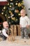 Two toddler boys in christmas interior