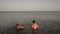Two toddler boys enjoying summer holidays in the sea
