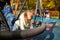 Two toddlers a boy and a girl play cheerfully and swing on a swing hammock on a playground in the autumn park