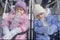 Two toddlers warmly dressed in their strollers, NY