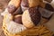 Two-tone muffins orange and chocolate closeup in basket