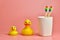 Two toothbrush and bathroom duck toys. LGBT personal care concept. Protect oral cavity, remove plaque and tartar