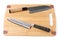 Two top grade japanese knives on cutting board