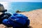 two tourist backpacks lie on the rocks on the cliff. benagil coast in portugal