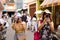 Two tourist casual women taking photo in walking street of Phuket province, Thailand