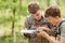 Two tourist determine the route map and navigator