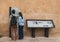 Two tourist read guiding map of Kasbah of the Udayas