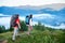 Two tourists with backpacks in hike on mountains of Carpathians