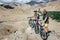 Two tourists with bikes explore Himalaya mountain region