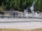 Two tourists enjoying the view at the Norris Geyser Basin