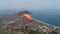 Two tourists fly by paragliding