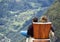 Two tourists looking at Geirangerfjord