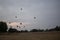 Two tourists watches the hot air balloons in the sky, Bagan, Nyaung-U, Myanmar