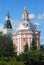 Two towers. Blue sky with clouds background. Trinity Sergius Lavra.