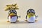 Two Toy Penguins in Holiday Portrait