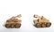 two toy tanks made by children from corrugated cardboard are fighting. toy cardboard tanks isolated on a white background.