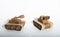 two toy tanks made by children from corrugated cardboard are fighting. toy cardboard tanks isolated on a white background.