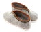 Two traditional grey felt slippers posed heel to toe