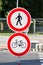 Two traffic signs forbidding entrance for pedestrians and cyclists as the crossing is reconstructed