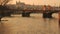 Two Trams Crossing the Legion Bridge in Prague During Sunset