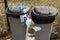 Two trash cans. Rubber gloves and medical masks are a new kind of garbage around the world