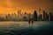 Two traveler man looking view skyline Kuala Lumpur city in swimming pool on the roof top of hotel at sunrise in