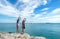 Two traveler young women seeing the beautiful beach and blue sky, so happy and relax.