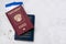 Two travelers passports Russian and Belarus with boarding passes for the plane. Travel concept Selective focus.