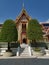 Two trees stand at the entrance of Buddhist temple Wat Ratchabophit