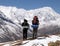Two trekkers and mount Tilicho