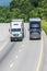 Two Trucks on Interstate Highway Vertical with Copy Space